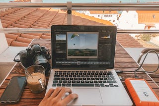 Working on a laptop outside.