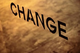 The word CHANGE written from the upper left side of the picture towards the lower right side represents a negative trend that must be changed