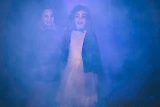 Ghostly figures of two girls.