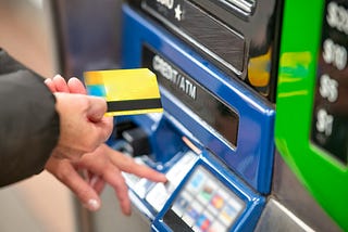 Person using an ATM machine