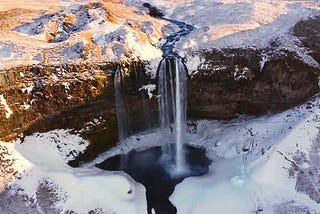 Beautiful Seljalandsfoss Waterfall with Snow in Winter in Iceland Without People