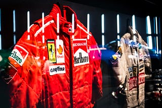 Bright red Ferrari F1 gear, which was worn by Michael Schumacher.