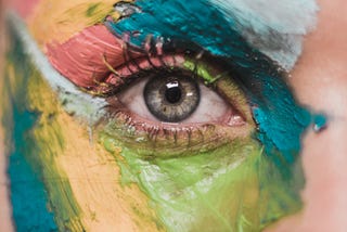Eye with colorful face paint
