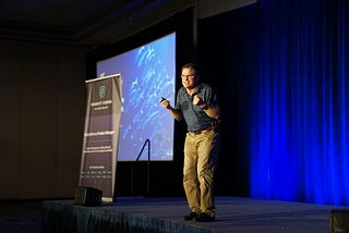 A storyteller onstage looking frustrated.