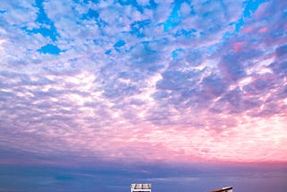 Photo of boat with cape may spelled on boat at New Jersey Beach. Photo on Dr. James Goydos 2021 article about melanoma in New Jersey.