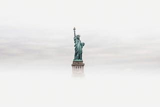 The statue of Liberty appearing out of the fog