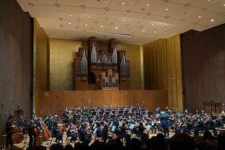 A wide shot of UC Berkeley’s Symphony Orchestra performing on stage.