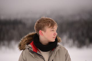 Young Swedish man in snowy landscape…