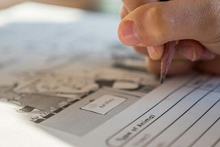 Student filling up a goal chart