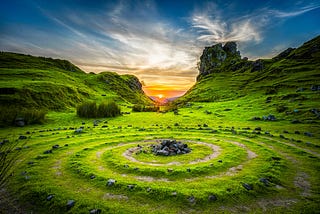 grassy area by the mountains