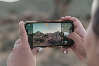 A person taking a picture with their smartphone