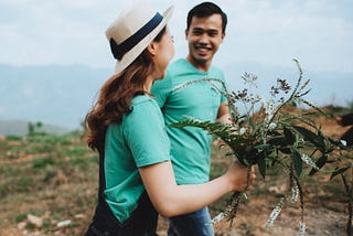 man and woman in an open field, who look like they’re the date to marry type