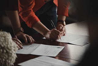 Person signing a contract