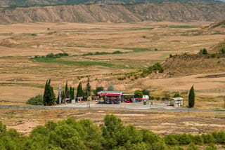 A photo of a gas station in the desert
