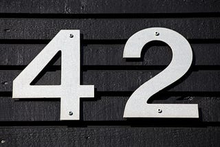 this is a photo of a wall with the number 42 attached to it.