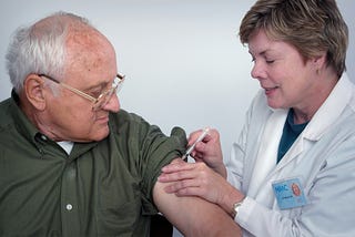 Man with doctor getting an injection