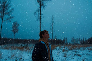 Image of a woman taking a stroll on a snowy winter day