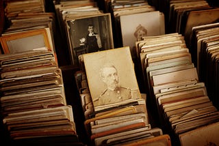 Old documents with photographs of historical figures.