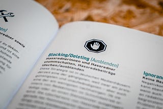 A book opened to a page on the topic of Blocking/Deleting