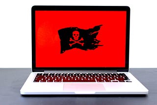 Laptop with pirate flag on screen