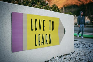A sign that reads: Love to learn