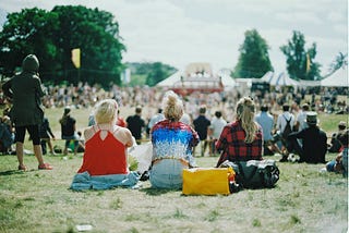 group of people on grass field under sunny day