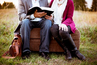 Man and woman reading the Bible