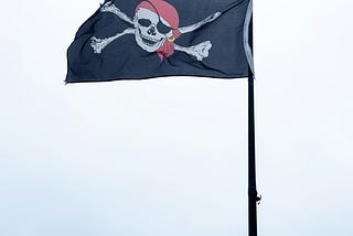 Jolly Roger flag flying in Swanage harbour