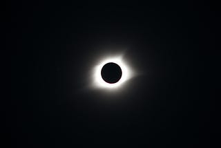 The sun being blocked out by the moon.