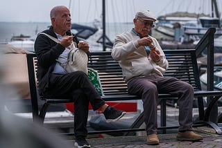men on a bench