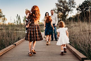 A Family on a wooden walkway