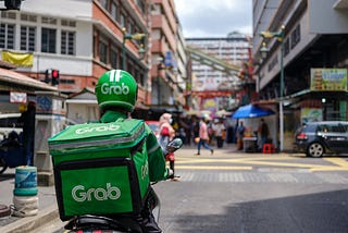 A Grab driver that bring food for completing delivery order request