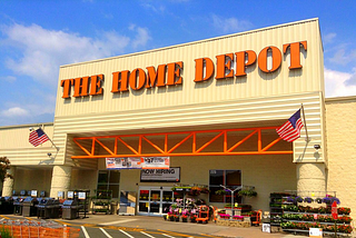 Orange Aprons and Grey Flooring in Every Aisle