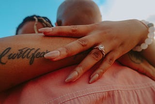 Couples hugging after a proposal.