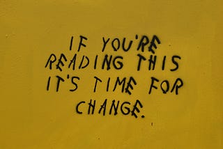 Graffiti that says ‘if you’re reading this it’s time for change.’