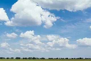 White clouds in a blue sky.