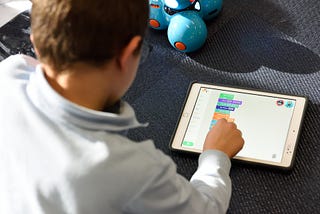 a boy learning to code