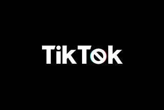 The writing TikTok, white on black background