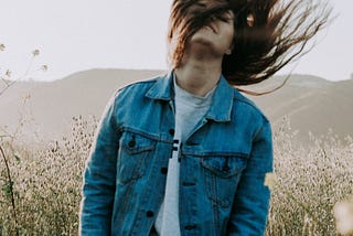 image of woman tossing hair around