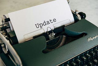 A typewriter with the word “update”