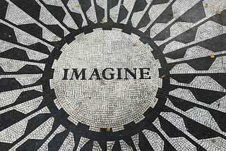 close up of the word imagine from the strawberry fields mosaic floor in NYC
