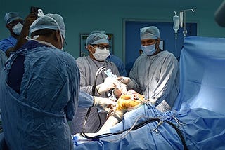 What are the pros and cons of getting a knee replacement at a young age (early twenties)?