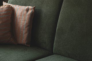 picture of a dark green sofa