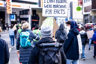people marching for facts