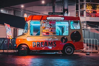 A Jest. An icecream truck with a sign “Dreams” showing on its side.