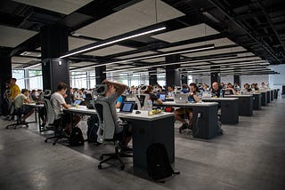 A group of people participating in hackathon