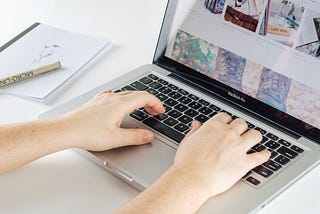 freelance writer typing on a computer keyboard