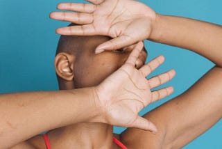 black female defending with hands in studio