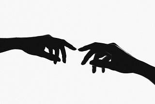 Two delicate female hands in black and white.