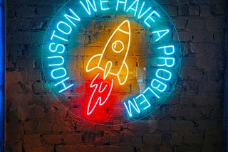 Sign board of a rocket and text alerting about a problem
